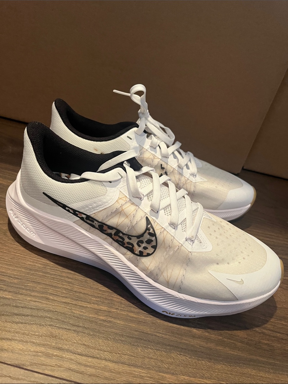 Nike Women’s White Sneakers with Leopard-Print Swoosh